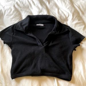 Black crop top with collar.